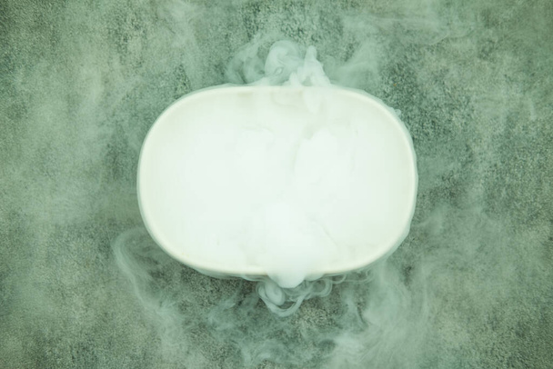 Dry ice smoke on cup. Cooling beverage and impressive effect concept - Foto, Imagem