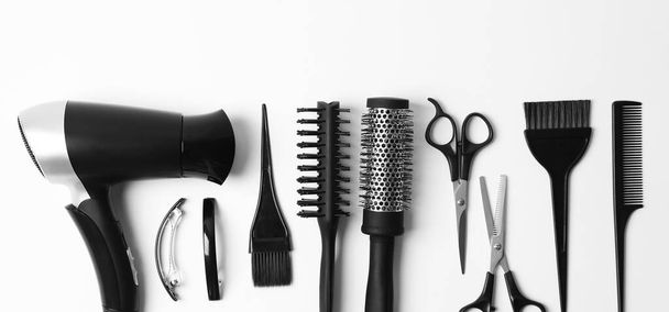 Set of different professional hairdresser tools on white background, flat lay. Banner design - Foto, imagen
