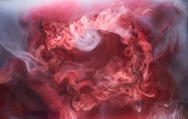 Black and red ink background, colorful fog, abstract swirling ocean, acrylic paint pigment underwater, white smoke - Foto, immagini