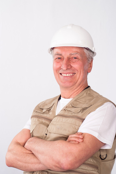 Senior builder in helmet - Foto, afbeelding