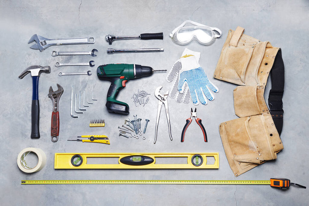 High angle shot of a tools against a gray background. - Photo, Image