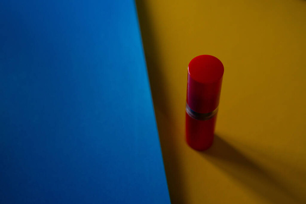 A closeup shot of red lens cleanser brush isolated on the bright background - Фото, зображення