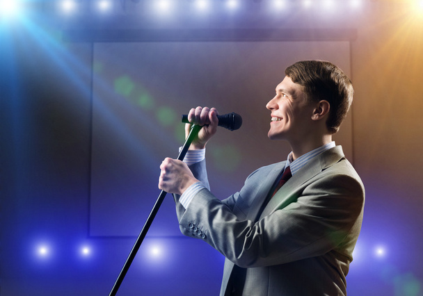 Businessman with microphone - Foto, Imagen