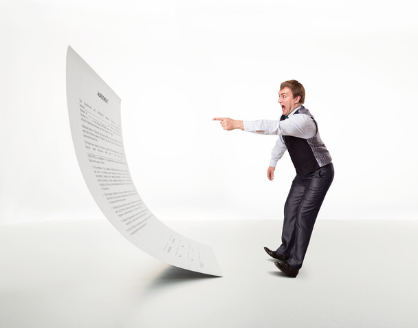 Man points to the document - 写真・画像