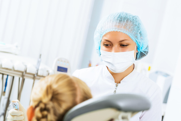 Dentist inspecting patient - Foto, imagen