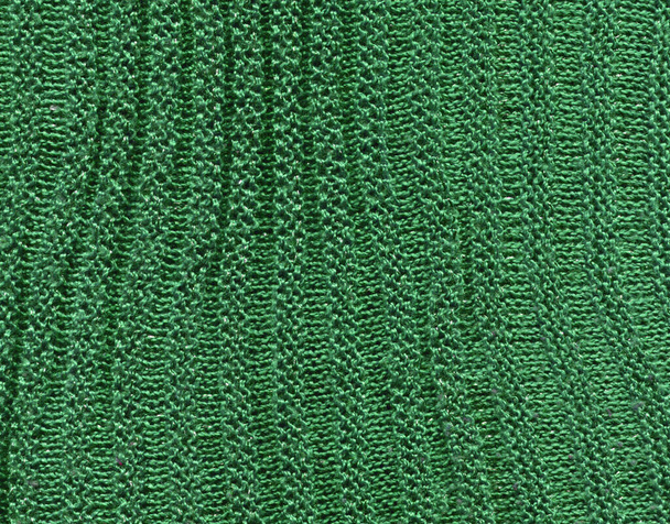 Kötött természetes textil zöld pulóver textúra. Kötött ökozöld pulóver tapéta textúrája. - Fotó, kép