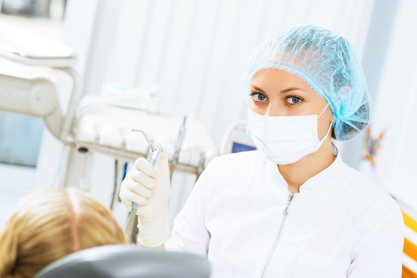 Dentist inspecting patient - Foto, afbeelding