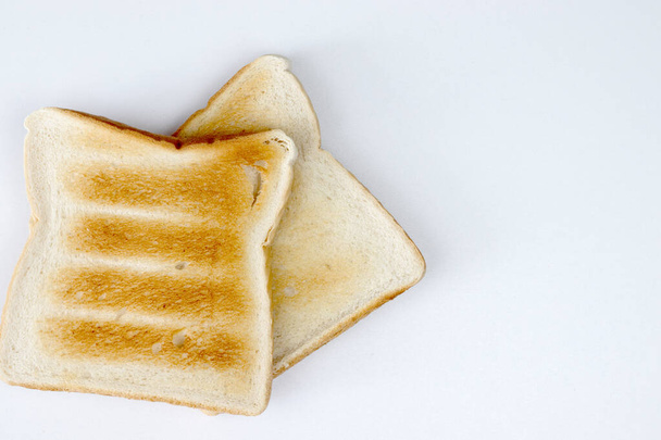 two slices of toast on a white background - Foto, immagini