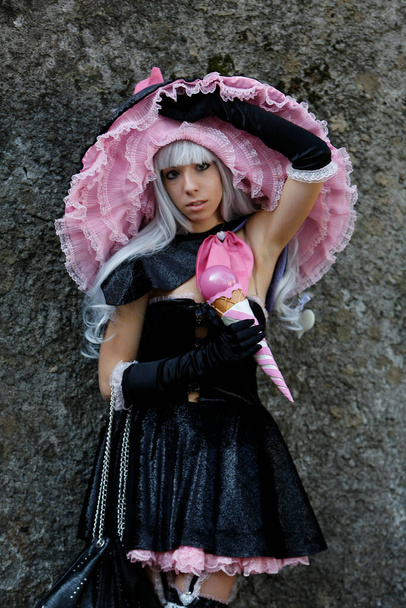 Lucca, Italy - 2018 10 31 : Lucca Comics free cosplay event around city singer with pink microphone. High quality photo - Foto, Imagen