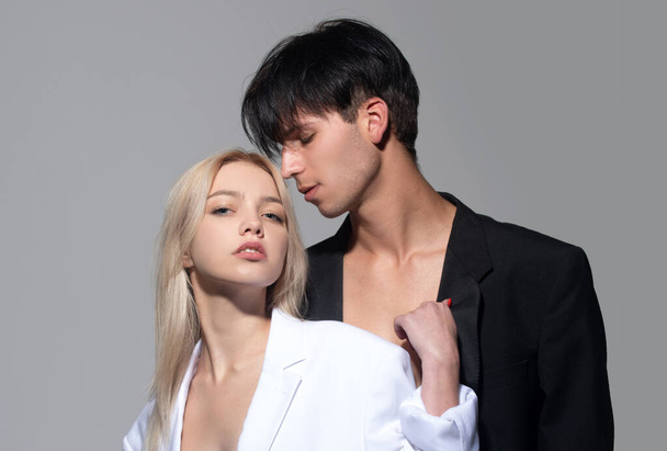 Young man and blonde woman. Sexy young couple in love. Young lovers hugging and embracing. Couple in love tenderness and affection - 写真・画像