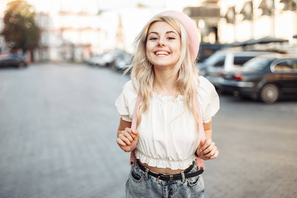 Portrait of a charming smiling girl in a beret in a European city. Young having fun laughing woman in trendy outfit. Lifestyle - Foto, afbeelding