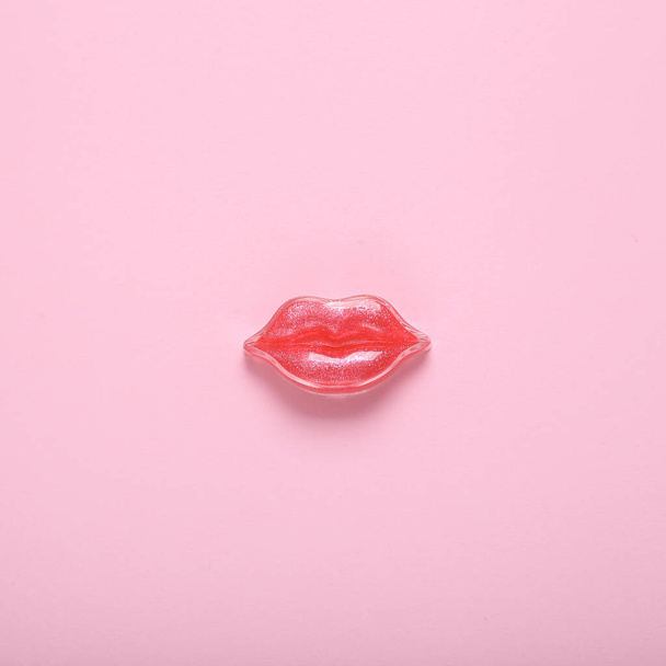 Red lips on a pink background. Beauty minimal concept - Photo, Image
