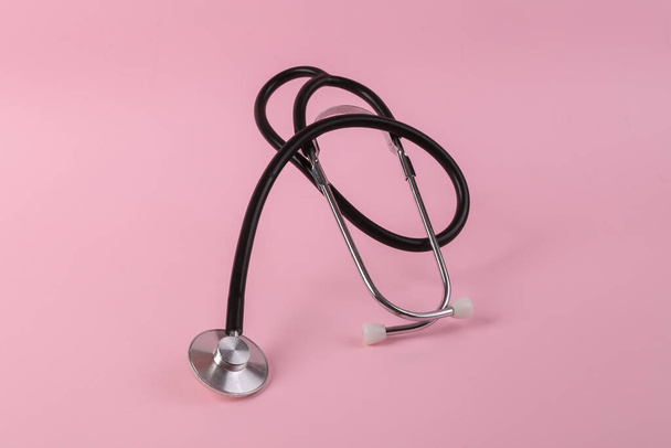 Medical stethoscope on pink background close up - Foto, Imagem