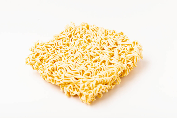 Raw instant noodles on white background. No clipping path. - Photo, Image