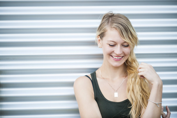 Smiling young blond woman - Φωτογραφία, εικόνα