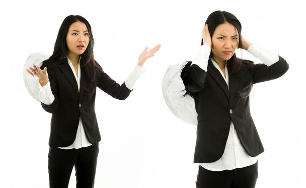Asian young woman dressed as angel scolding to another isolated on white background - Photo, Image