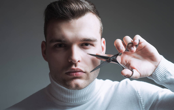 Create your style. Macho confident barber cut hair. Barbershop service concept. Professional barber equipment. Cut hair. Man strict face hold scissors. Barber glossy hairstyle hold steel scissors. - Photo, image