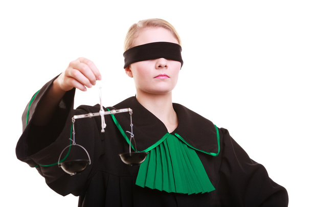 Female lawyer attorney in classic polish black green gown and scales - Φωτογραφία, εικόνα