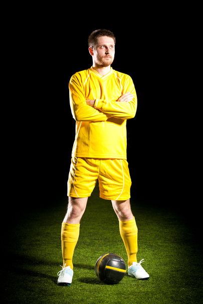 Football player on grass field - Fotoğraf, Görsel