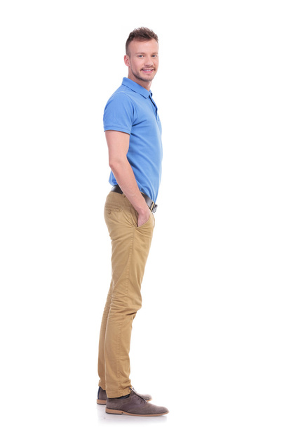 side of casual young man with hand in pocket - Photo, Image