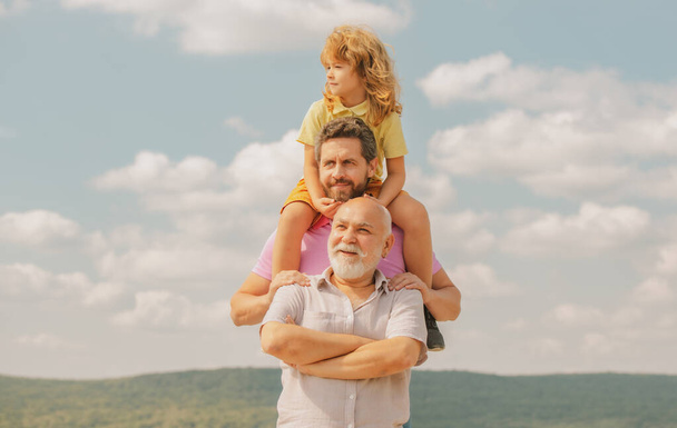 Generation of people and stages of growing up. Men generation grandfather father and son outdoor. Fathers day concept. Men in different ages - Foto, Imagem