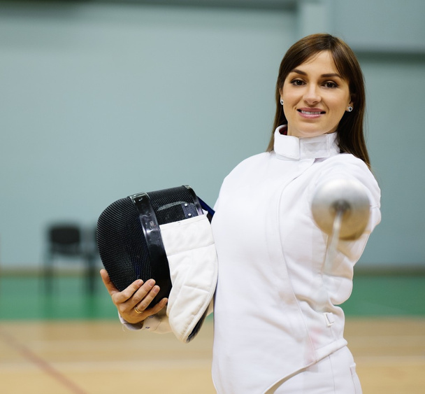 Young woman fencer with epee  - Photo, Image