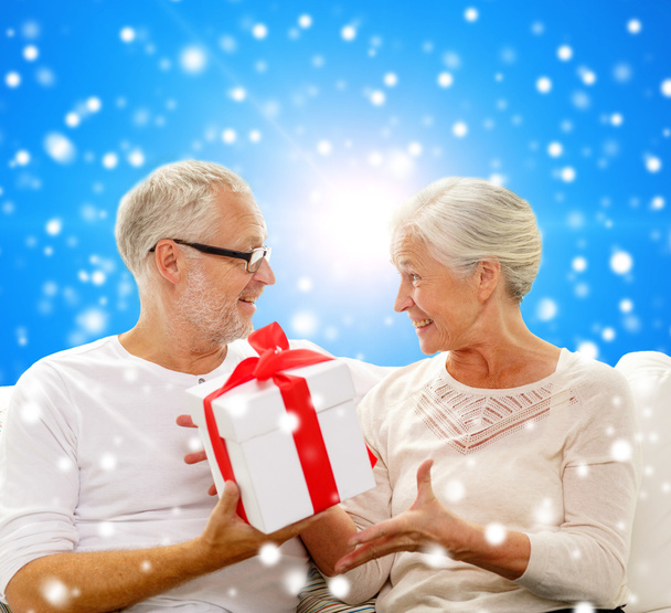happy senior couple with gift box at home - Photo, Image