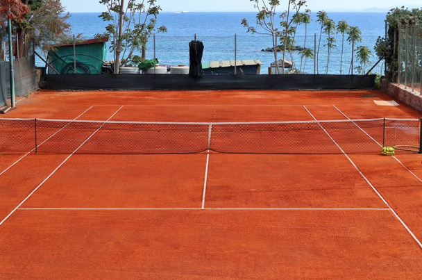 Ischia, Campania, Italy - May 14, 2022: Clay tennis court on the Lungomare Colombo - Photo, Image