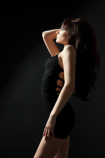 Woman posing wearing black dress - Fotoğraf, Görsel