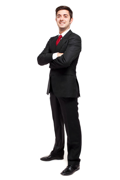 Young businessman with folded arms smiling - Foto, imagen