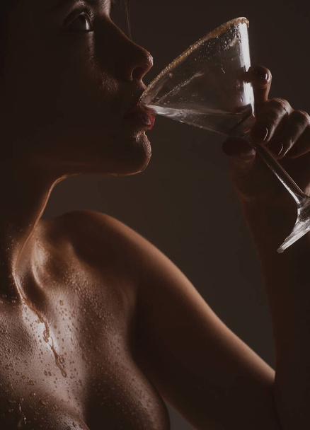 Sensual woman drinking martini. Alcohol party. Girl drink cocktail closeup - Photo, Image