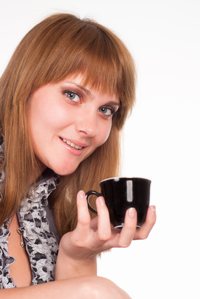 Girl holding a cup - Fotoğraf, Görsel