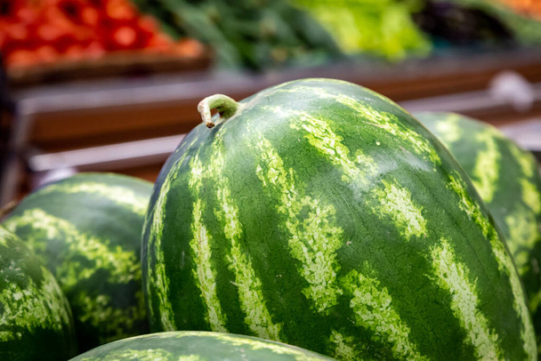 Watermelons for sale in a supermarket, with a shallow depth of field - 写真・画像