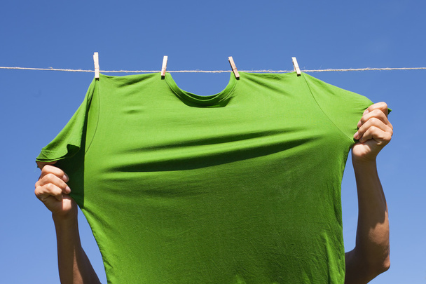 Hand hanging shirt. - Foto, afbeelding