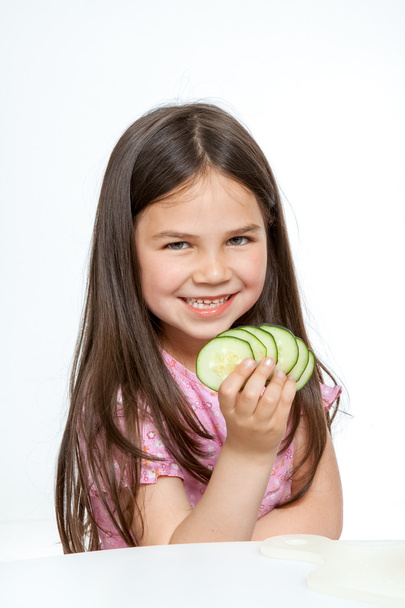 Beautiful little childl with vegetable - Fotografie, Obrázek