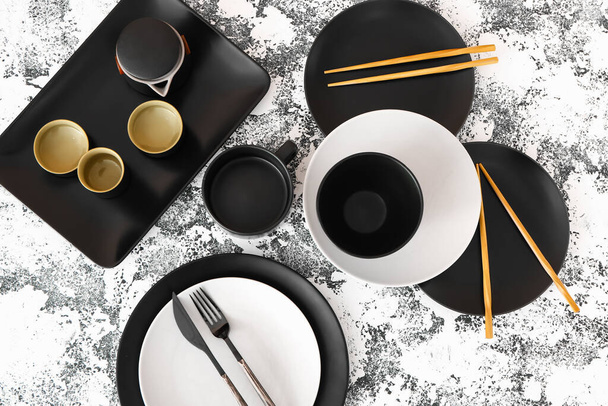 Stylish table setting with chopsticks on light background - Photo, Image