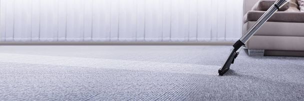 Gros plan d'un aspirateur sur tapis gris
 - Photo, image