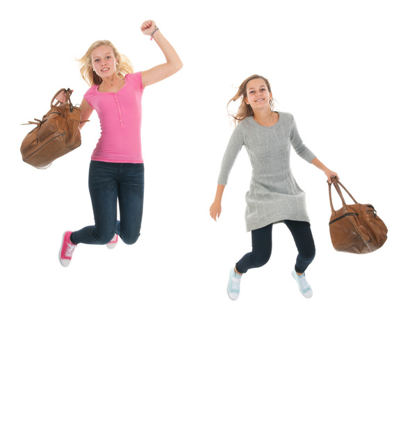 Jumping youth with school bags - Fotó, kép