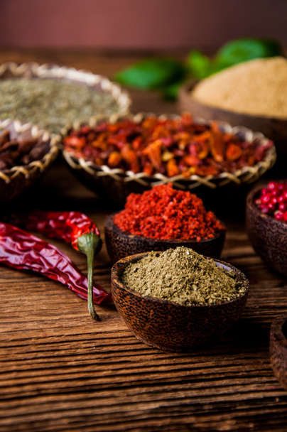 Spices in wooden Indonesian bowls - Фото, зображення
