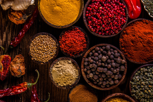 Variability of Asian spices on wooden table - Foto, immagini