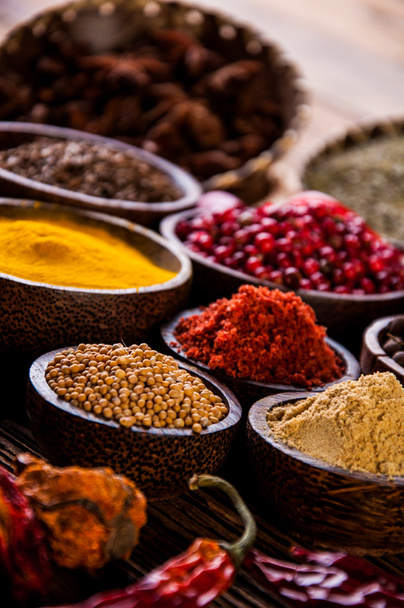 Oriental hot spices on wooden table - Fotó, kép