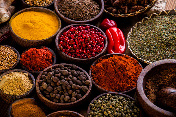 Oriental hot spices on wooden table - Φωτογραφία, εικόνα