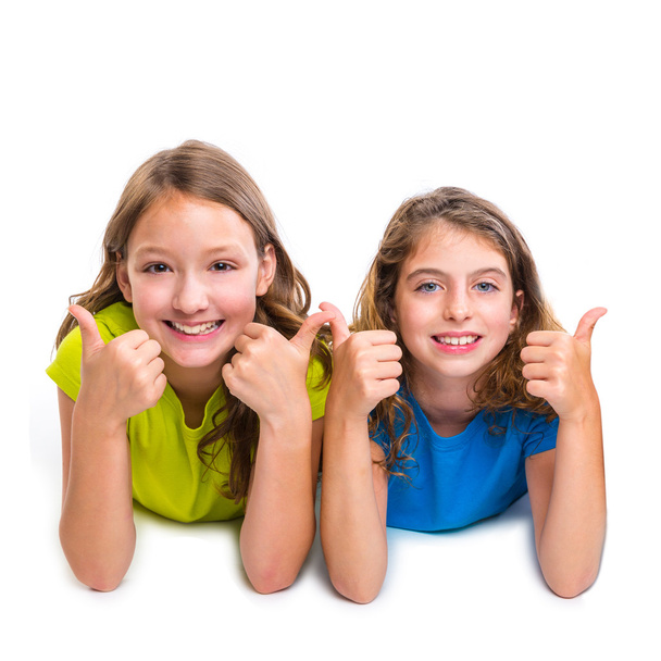two kid girls happy ok thumbs up gesture lying - Foto, immagini