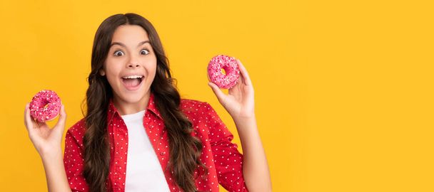 amazed teen girl hold sweet baked doughnut dessert, diet. - Photo, image