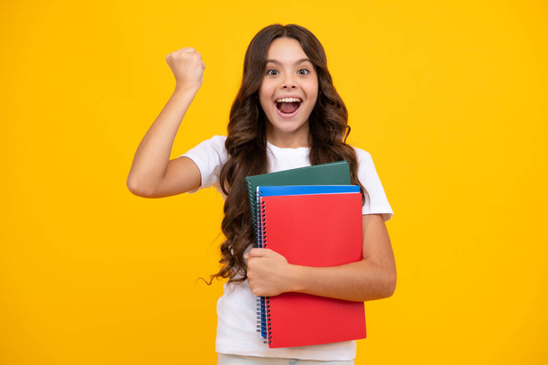 Amazed teen girl. Back to school. Portrait of teenage school girl with books. Children school and education concept. Schoolgirl student. Excited expression, cheerful and glad - Фото, зображення