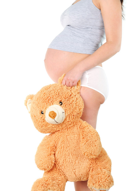 Pregnant woman with child's toy - Φωτογραφία, εικόνα