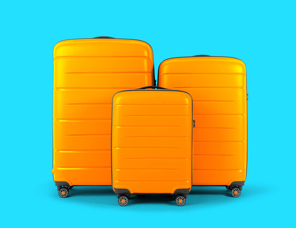 Set of stylish yellow suitcases for travel on blue background. - Photo, Image