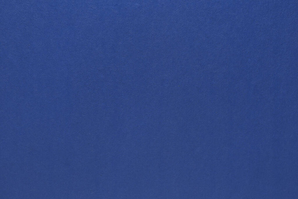 Blue paper texture. Blank blue paper background. - Foto, afbeelding