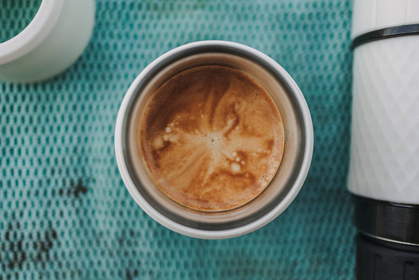 Above view of french press coffee with marble crema. - Foto, Imagen
