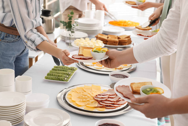 People taking food during breakfast, closeup. Buffet service - Photo, Image